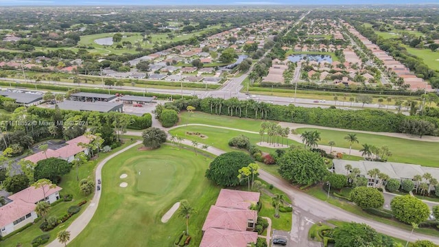 drone / aerial view featuring a residential view and view of golf course