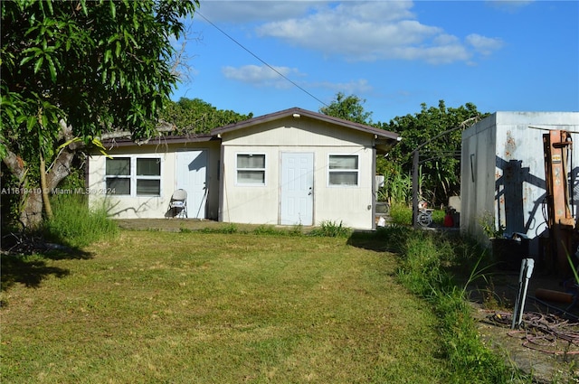 view of outdoor structure with a lawn