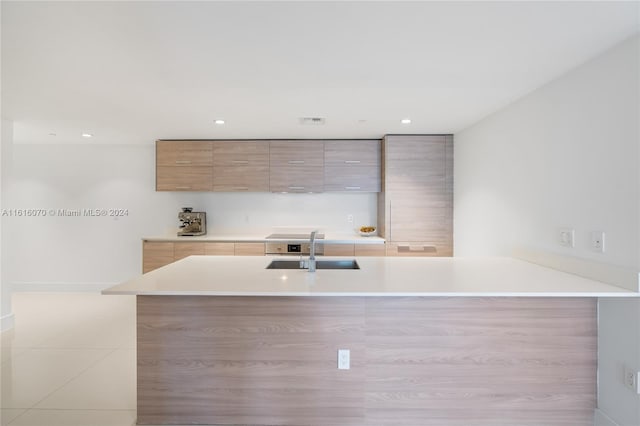 kitchen featuring sink and kitchen peninsula