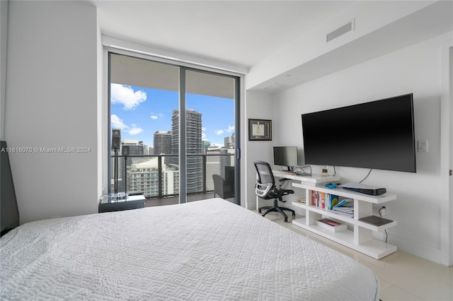 tiled bedroom with access to exterior and floor to ceiling windows