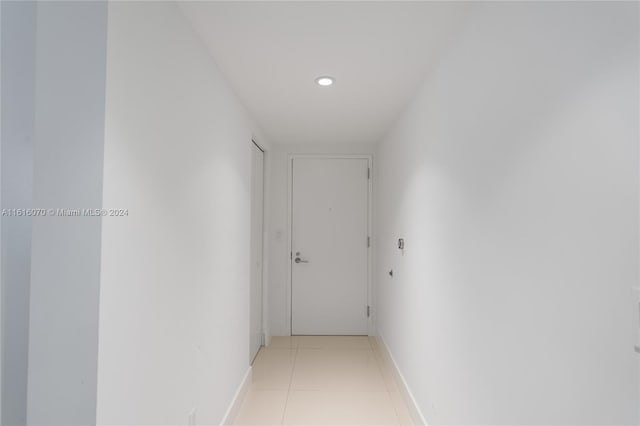 hallway featuring light tile patterned floors