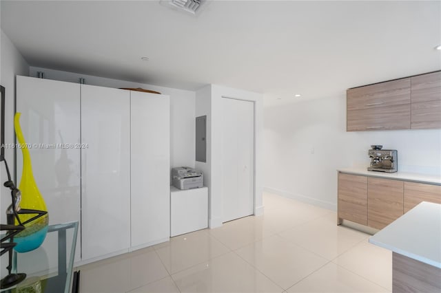 kitchen featuring light tile patterned flooring and electric panel