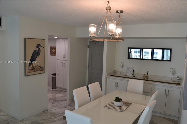 dining room featuring a textured ceiling