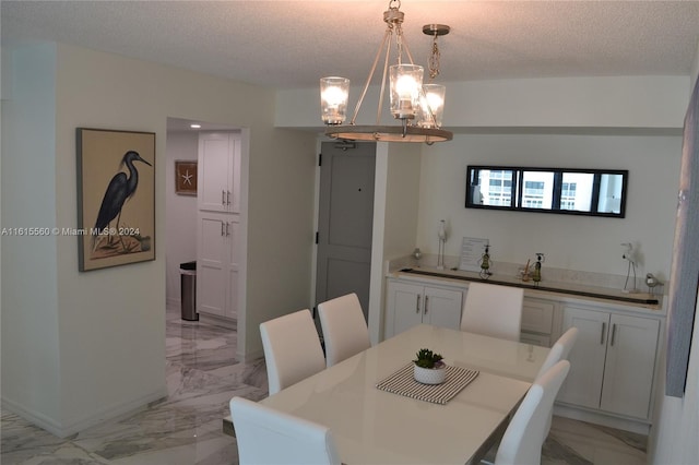 dining room featuring a textured ceiling