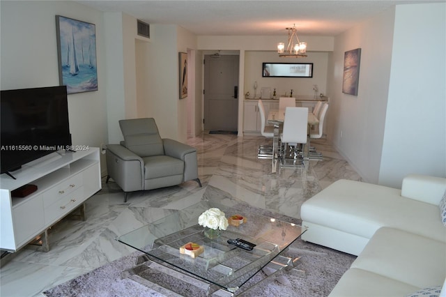 living room with a notable chandelier