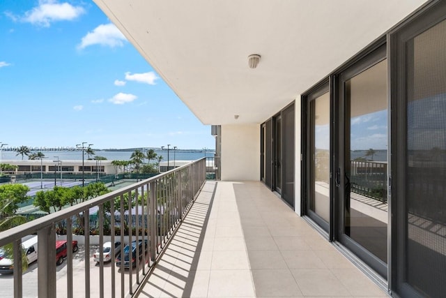 balcony featuring a water view