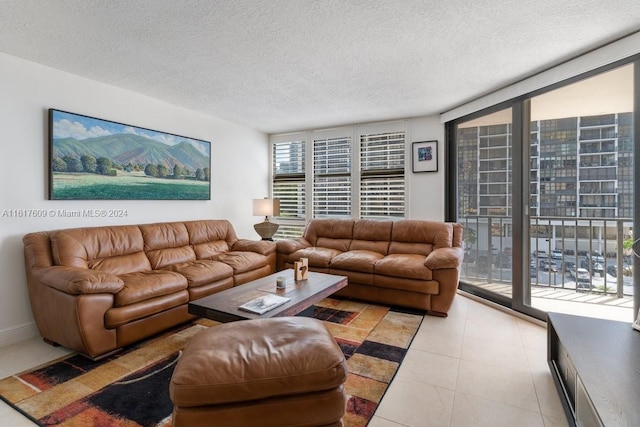 tiled living room with a wealth of natural light and a textured ceiling