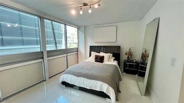 bedroom with light tile patterned flooring