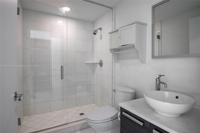 bathroom with vanity, toilet, and an enclosed shower