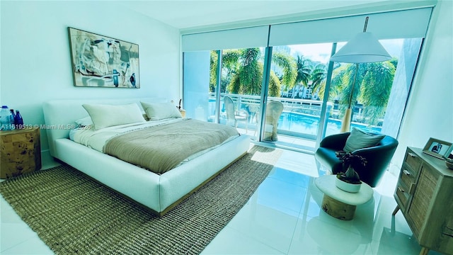 tiled bedroom with access to outside and a wall of windows