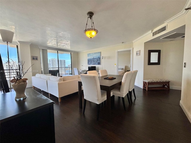 dining area featuring dark hardwood / wood-style floors, expansive windows, and ornamental molding