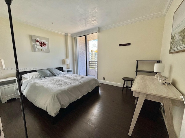 bedroom featuring dark wood-type flooring, crown molding, and access to outside