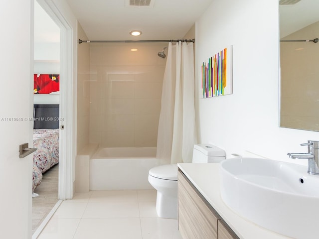 full bathroom with tile patterned floors, toilet, vanity, and shower / bathtub combination with curtain