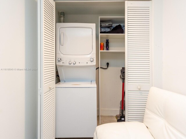 laundry room with stacked washer and clothes dryer