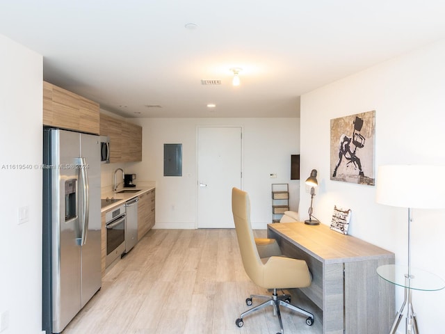 121 NE 34th St Unit 1014, Miami, FL 33137 - kitchen with appliances with stainless steel finishes, light hardwood / wood-style flooring, sink, and electric panel