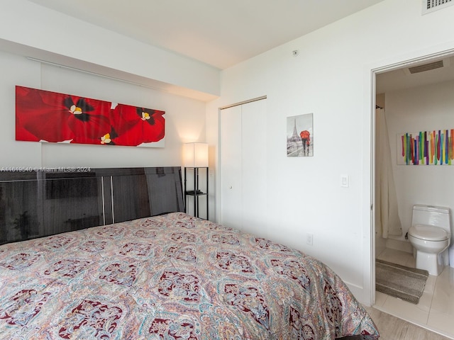 121 NE 34th St Unit 1014, Miami, FL 33137 - bedroom with a closet and connected bathroom