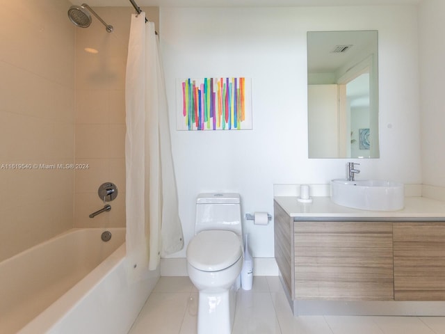 full bathroom featuring shower / tub combo with curtain, vanity, tile patterned flooring, and toilet