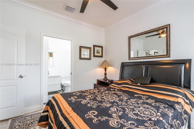 bedroom featuring ceiling fan, a raised ceiling, ornamental molding, and light hardwood / wood-style flooring