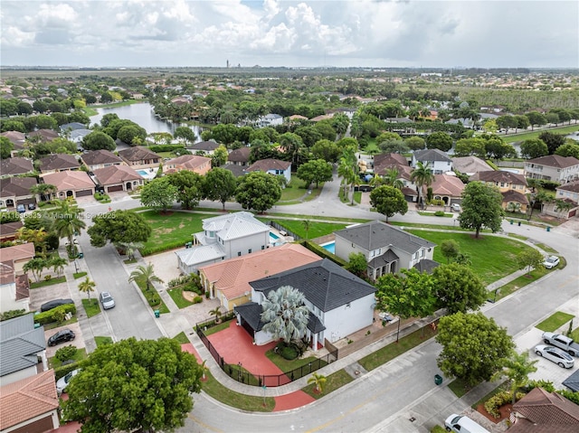 aerial view with a water view and a residential view