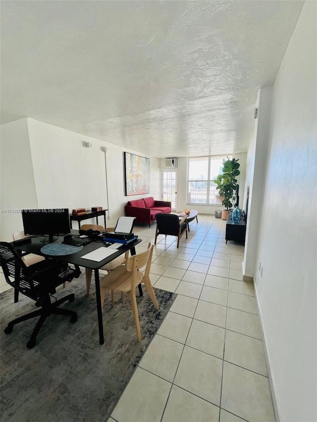 tiled dining room with a textured ceiling