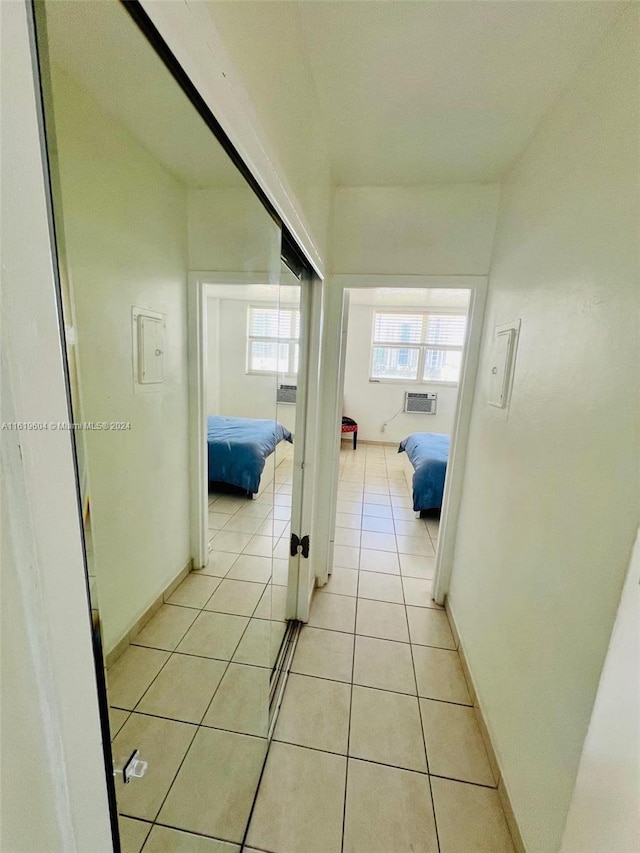 hallway with light tile patterned floors