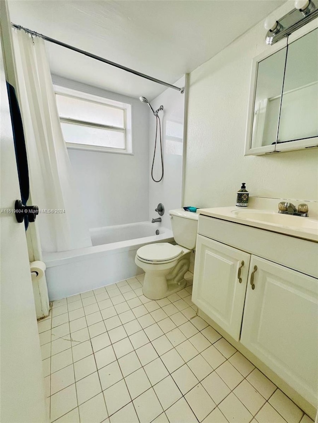 full bathroom featuring tile patterned flooring, vanity, shower / bath combination with curtain, and toilet