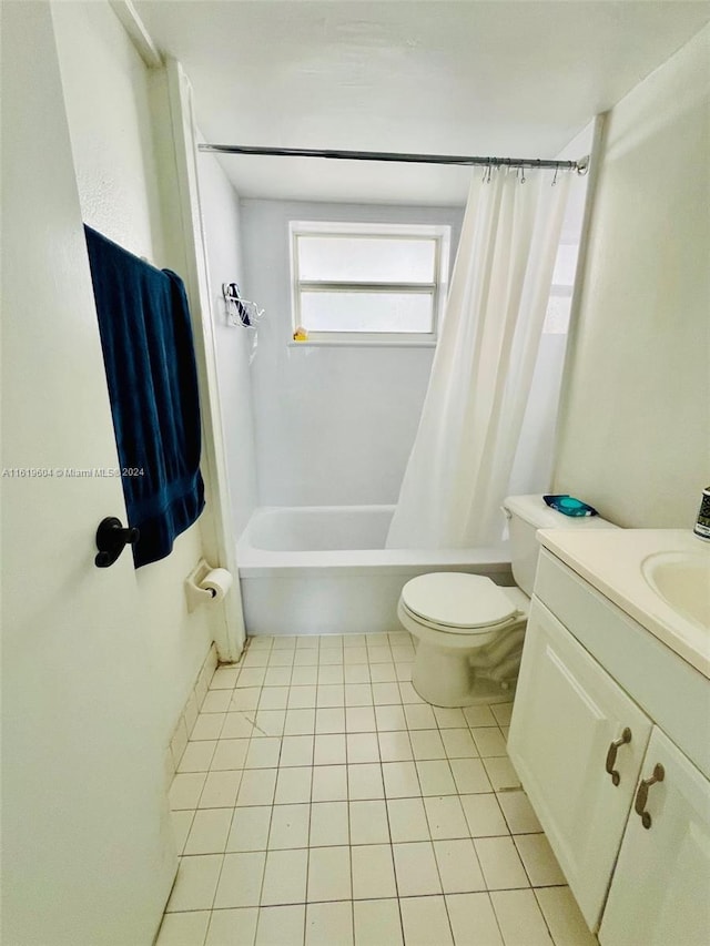 full bathroom with tile patterned flooring, vanity, toilet, and shower / tub combo with curtain