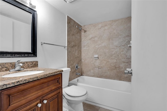 full bathroom featuring tiled shower / bath combo, toilet, tile patterned floors, and vanity