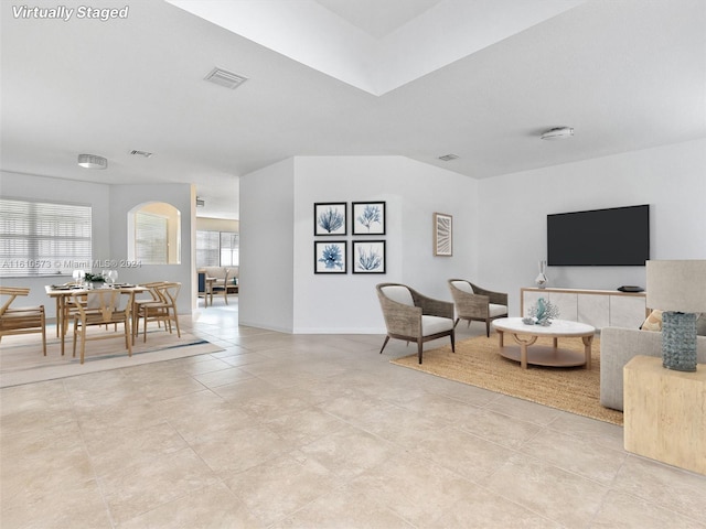 living room with light tile patterned flooring