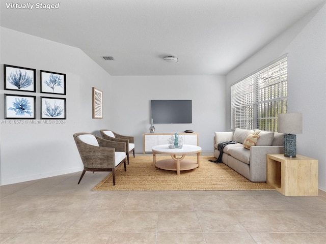 living room featuring light tile patterned flooring