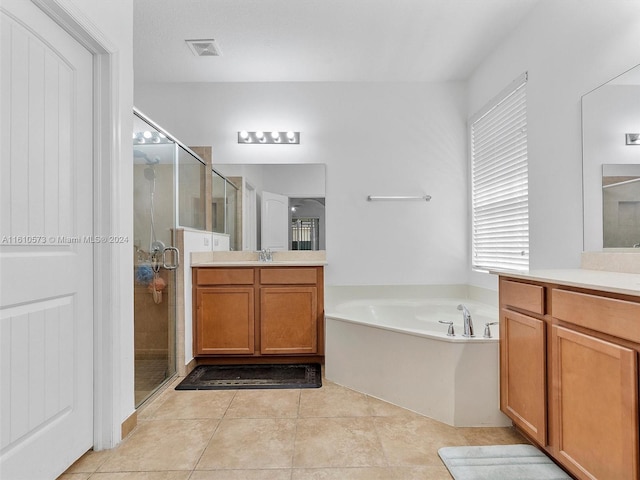 bathroom featuring vanity, separate shower and tub, and tile patterned flooring