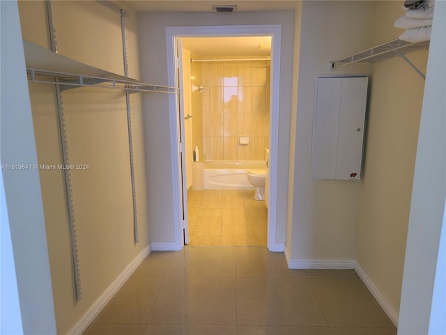 hallway with light tile patterned floors