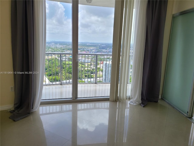 unfurnished room with light tile patterned floors