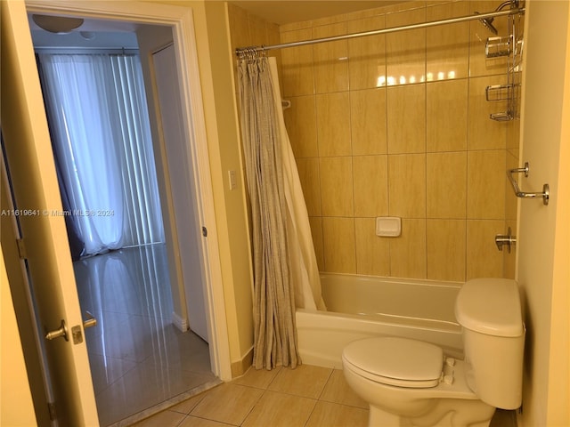 bathroom with toilet, shower / bath combination with curtain, and tile patterned floors