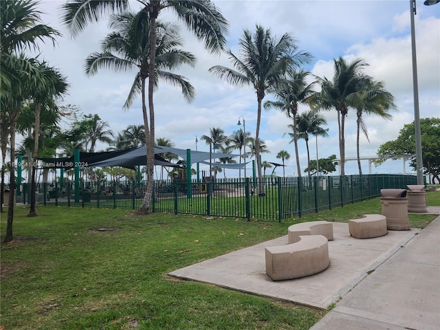 surrounding community featuring a lawn and a playground