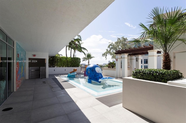 view of pool featuring a patio