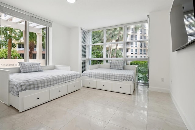 bedroom featuring multiple windows