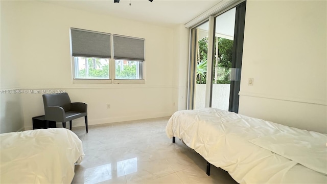 bedroom featuring access to outside and multiple windows