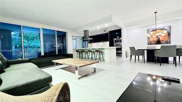 living room featuring wood-type flooring, a chandelier, and floor to ceiling windows