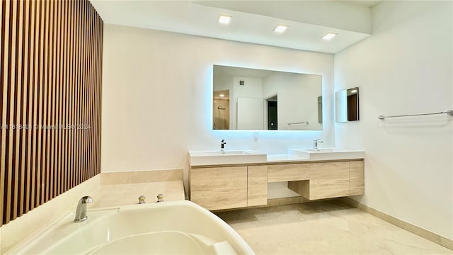 bathroom with vanity and a tub to relax in