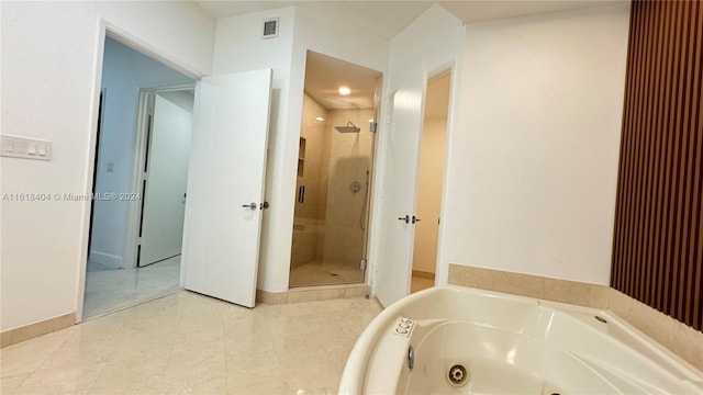 bathroom featuring independent shower and bath and tile patterned floors