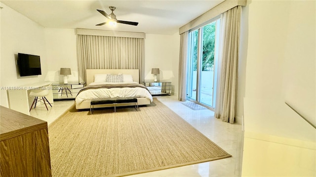 bedroom featuring ceiling fan and access to exterior