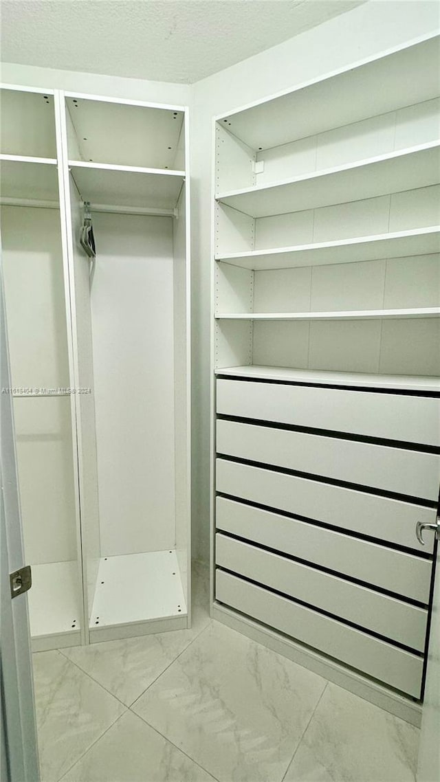 spacious closet with radiator heating unit