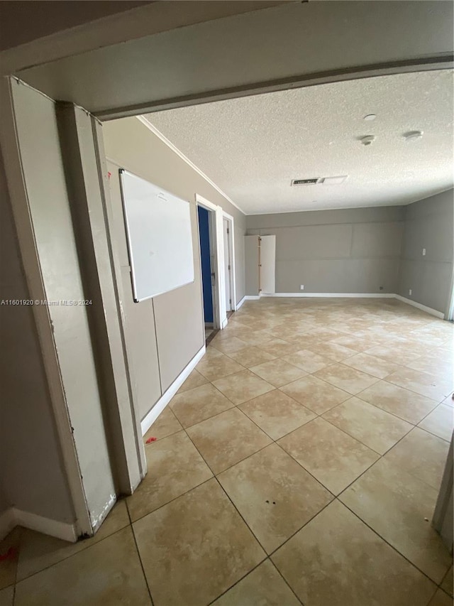 1926 Ramsey Dr, Lake Worth, FL 33461 - unfurnished room with a textured ceiling and light tile patterned floors
