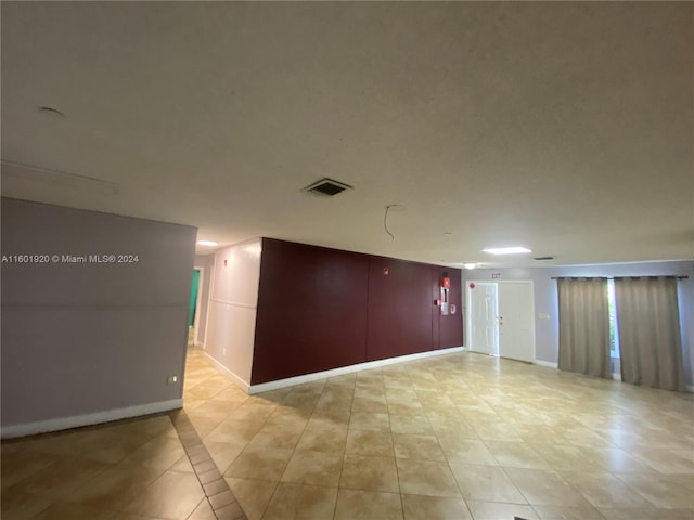 view of tiled spare room