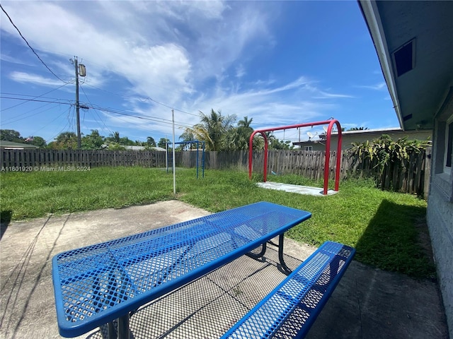 1926 Ramsey Dr, Lake Worth, FL 33461 - view of swimming pool featuring a fenced backyard, a patio, and a playground