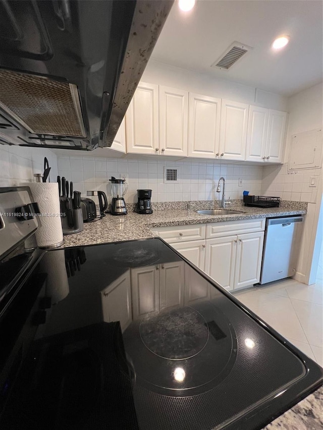 kitchen with tasteful backsplash, visible vents, white cabinetry, a sink, and dishwasher