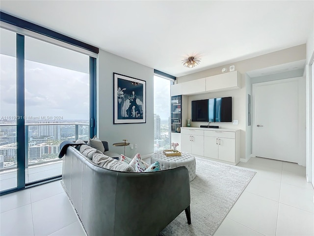 tiled living room featuring a wall of windows and plenty of natural light