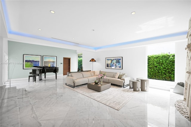 tiled living room with a raised ceiling