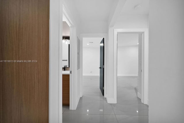 hallway with light tile patterned floors